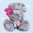 Мишка Тедди с алым цветком