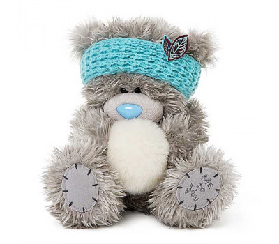 Мишка Тедди в голубой повязке на голове и со снежком